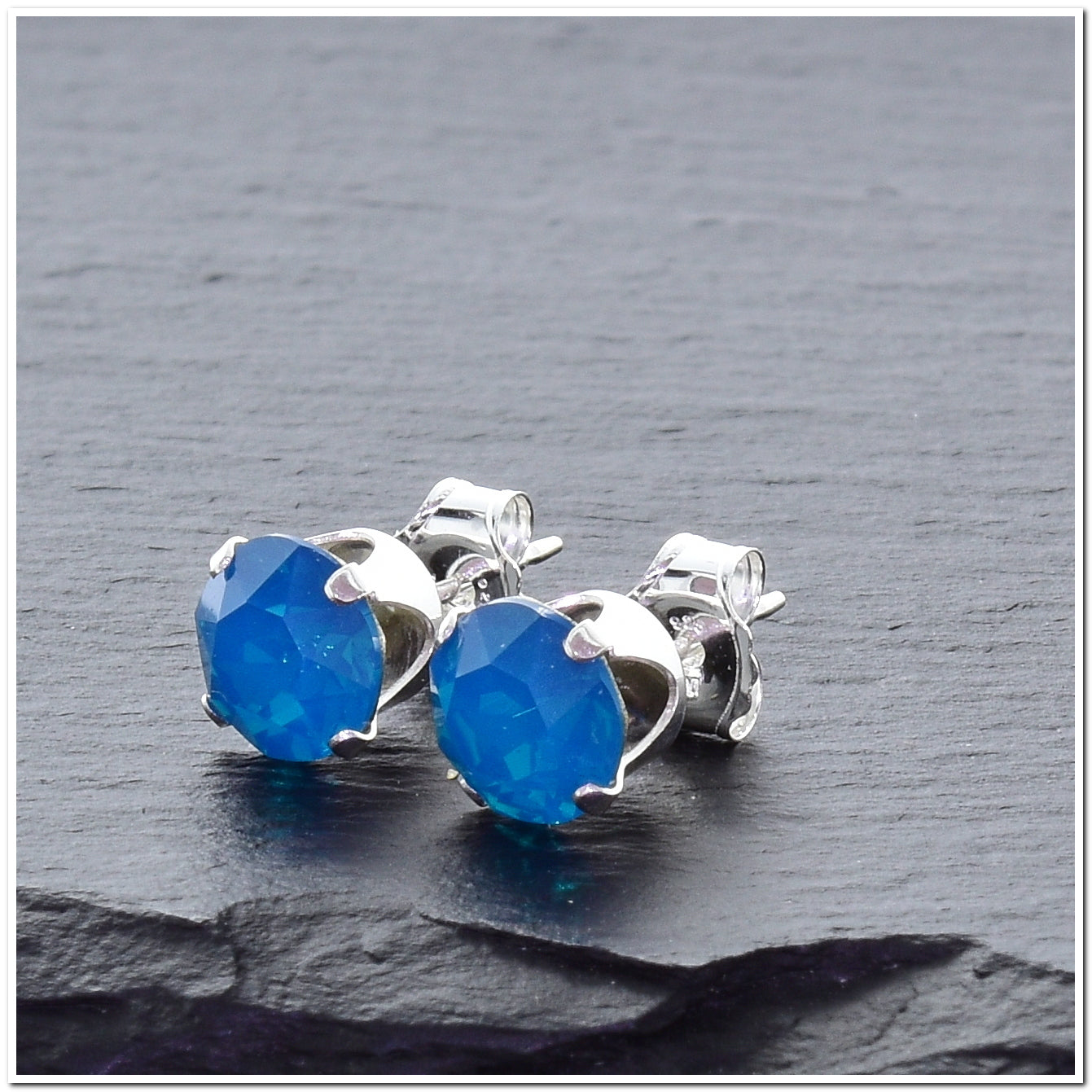 pewterhooter® Women's Classic Collection 925 Sterling silver earrings with sparkling Caribbean Blue Opal crystals, packaged in a gift box for any occasion.