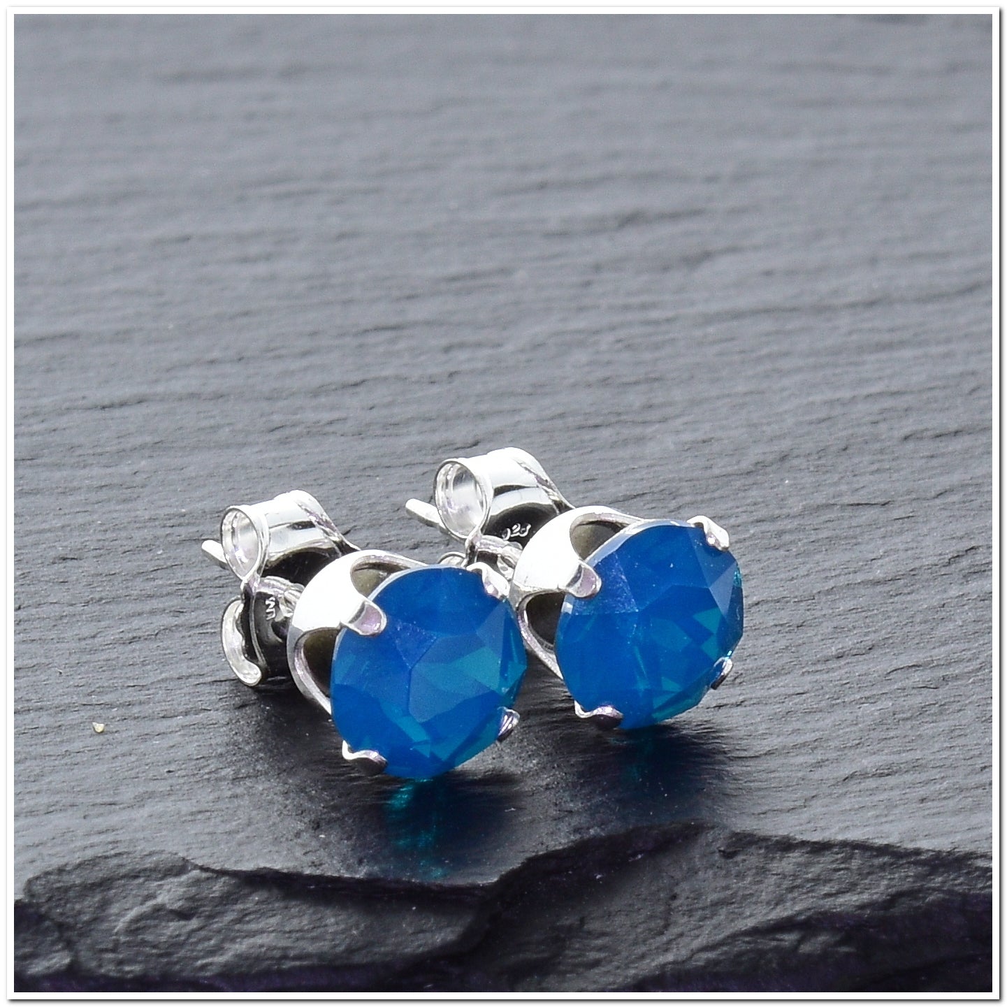 pewterhooter® Women's Classic Collection 925 Sterling silver earrings with sparkling Caribbean Blue Opal crystals, packaged in a gift box for any occasion.